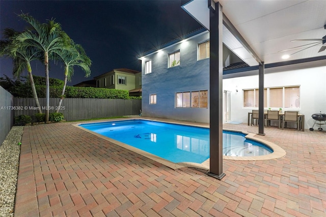 view of swimming pool with a patio and ceiling fan