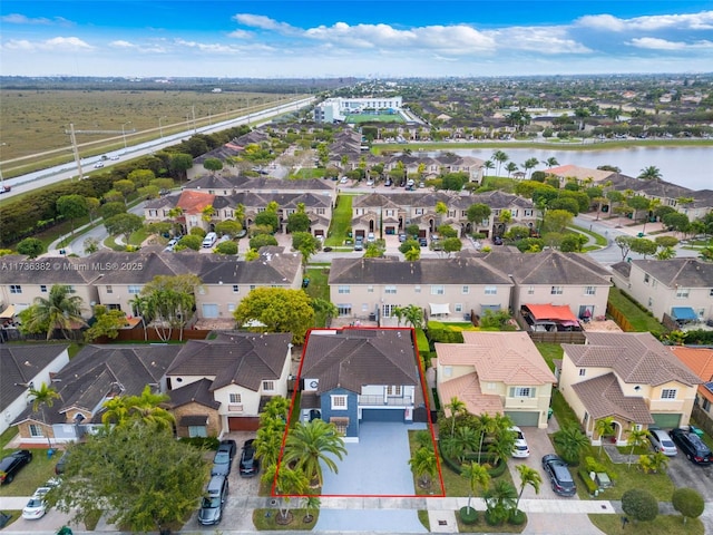 bird's eye view with a water view