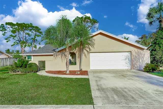 view of front of house featuring a garage and a front yard