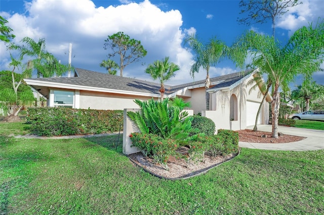 view of side of property with a garage and a yard