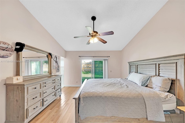 bedroom with ceiling fan, access to outside, multiple windows, and light wood-type flooring