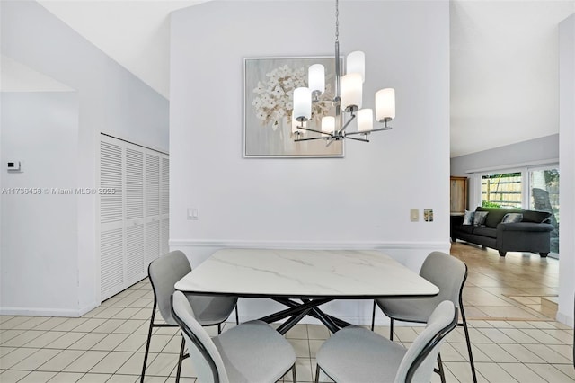 dining area with an inviting chandelier and light tile patterned flooring