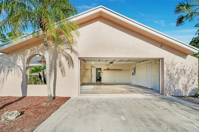 exterior space featuring a garage and electric panel