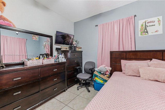 bedroom with light tile patterned floors