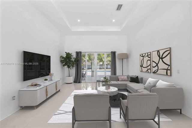empty room featuring light tile patterned floors, a tray ceiling, and recessed lighting