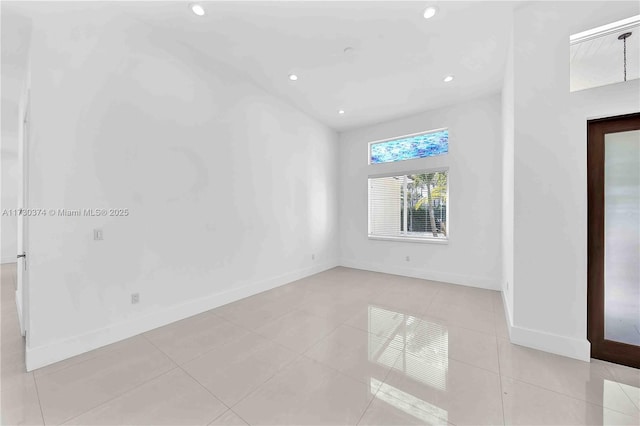 spare room with recessed lighting and light tile patterned floors
