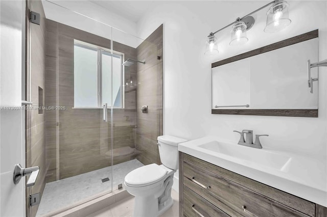 bathroom featuring vanity and a shower stall