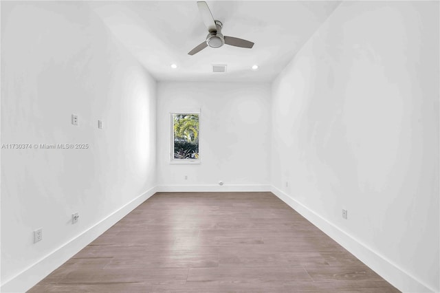unfurnished room with a ceiling fan, wood finished floors, and recessed lighting