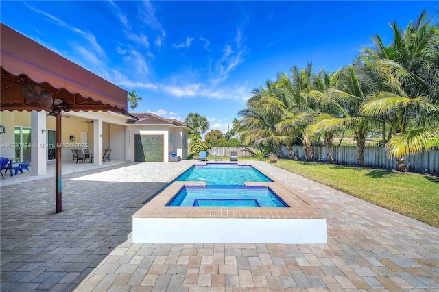 view of swimming pool with an in-ground hot tub, a patio, a fenced backyard, and french doors