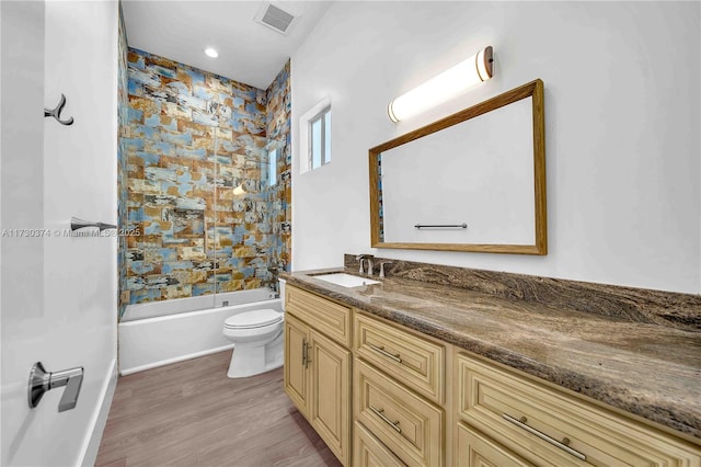 full bathroom with vanity, shower / tub combination, and wood finished floors