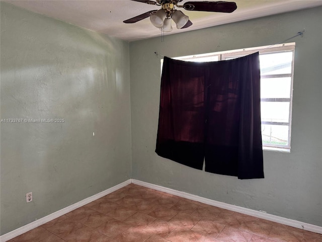 spare room with ceiling fan