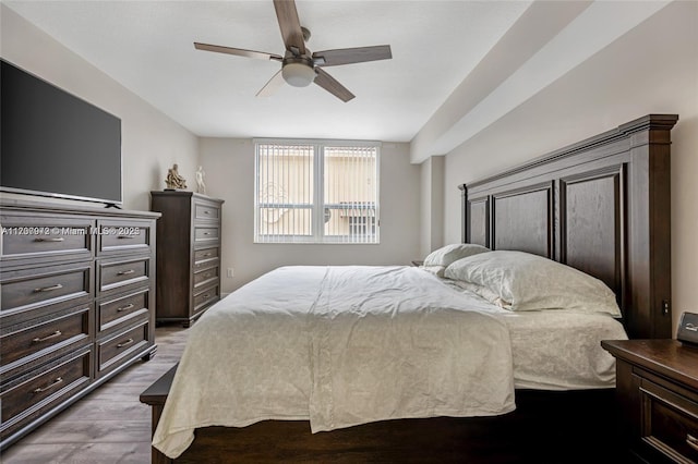 bedroom with light wood-style flooring and ceiling fan