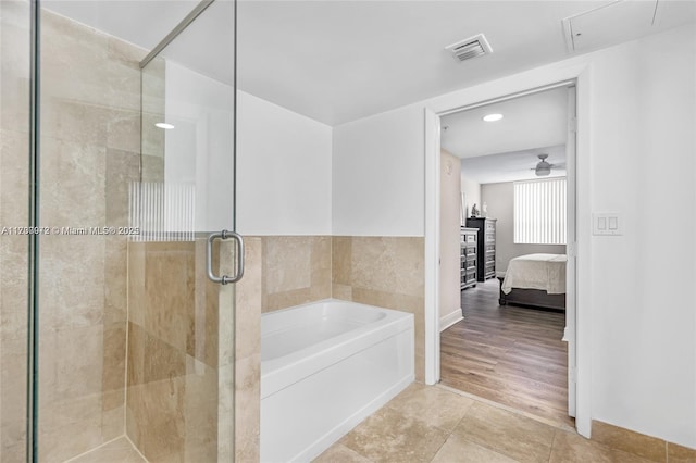 ensuite bathroom featuring a stall shower, visible vents, a ceiling fan, ensuite bathroom, and a bath