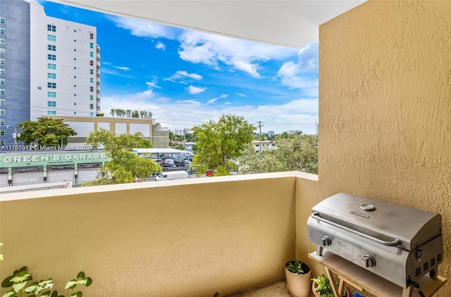 balcony featuring a view of city and a grill