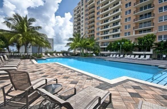 pool with a patio area