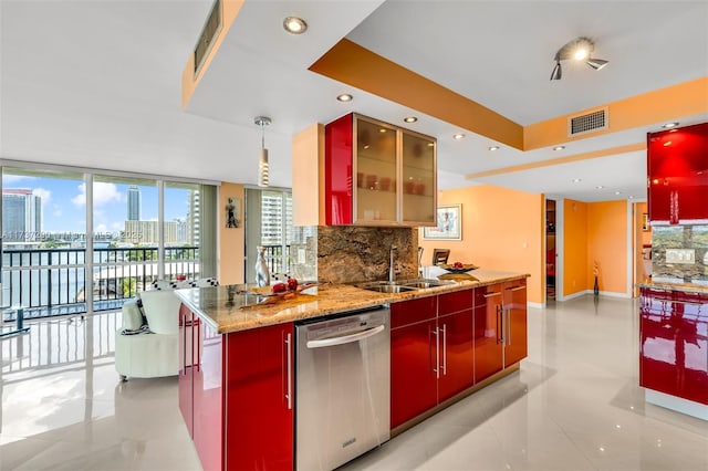 kitchen featuring sink, tasteful backsplash, hanging light fixtures, dishwasher, and light stone countertops