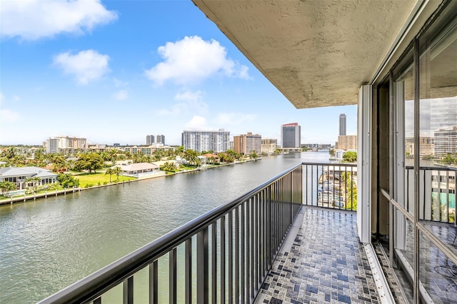 balcony featuring a water view