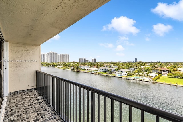 balcony featuring a water view