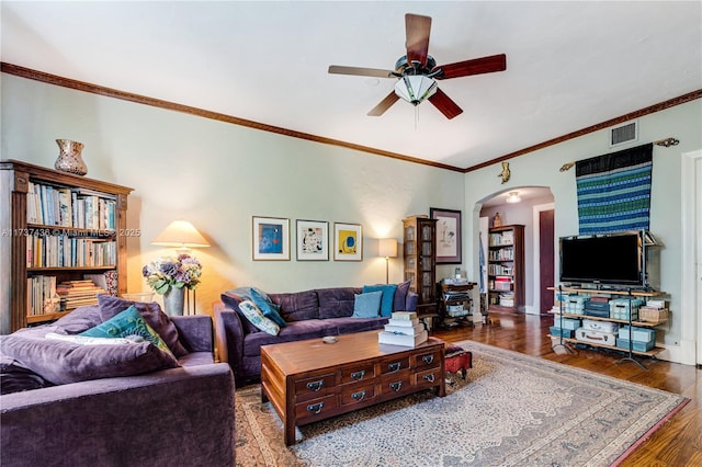 living room with crown molding, ceiling fan, and dark hardwood / wood-style flooring