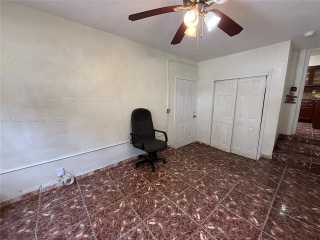 unfurnished room with a textured ceiling