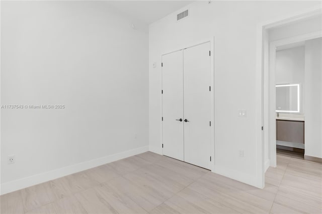 unfurnished bedroom with a closet