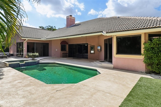 view of swimming pool featuring a patio area and ceiling fan