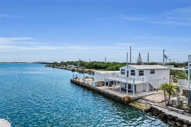 dock area featuring a deck with water view