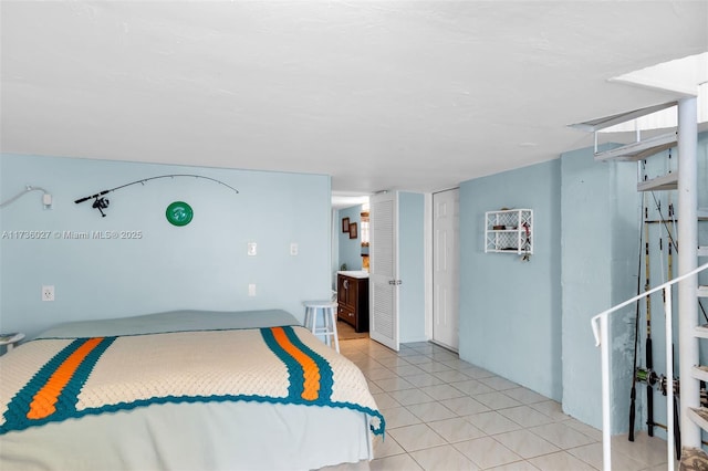 bedroom featuring a closet and light tile patterned flooring