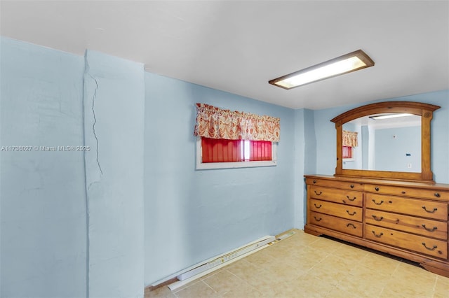 unfurnished bedroom featuring a baseboard radiator