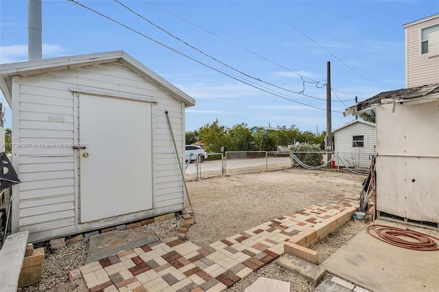 view of patio with a storage unit