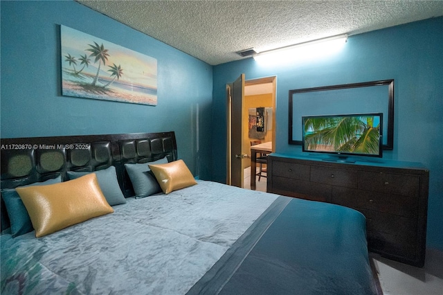 bedroom featuring a textured ceiling