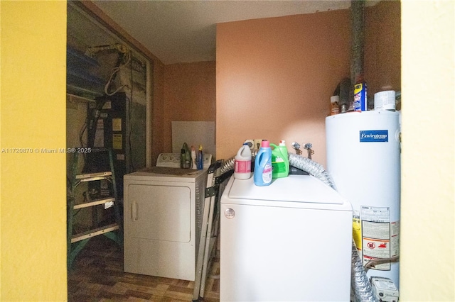 clothes washing area with water heater and washing machine and clothes dryer