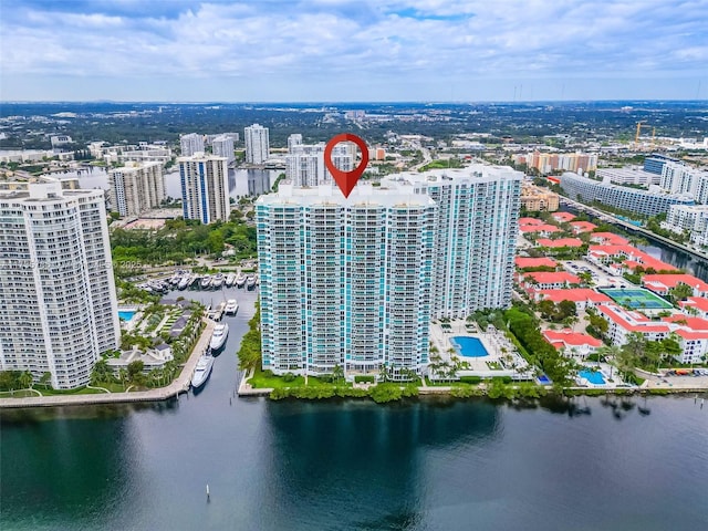 birds eye view of property with a water view