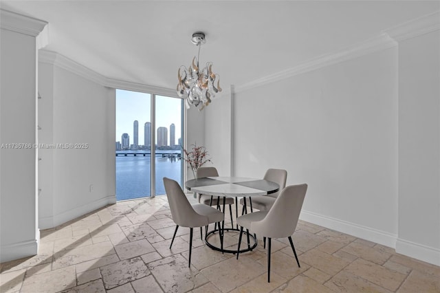 dining area featuring an inviting chandelier and ornamental molding