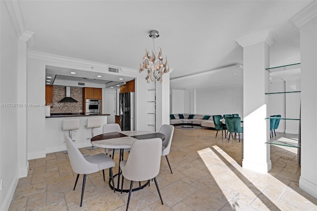 dining space featuring an inviting chandelier and crown molding