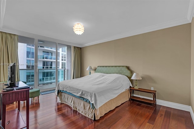 bedroom with expansive windows, crown molding, hardwood / wood-style floors, and access to exterior