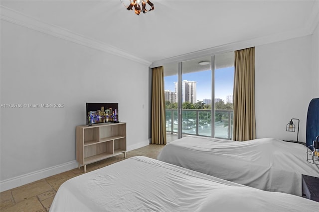 bedroom featuring expansive windows, crown molding, and access to exterior