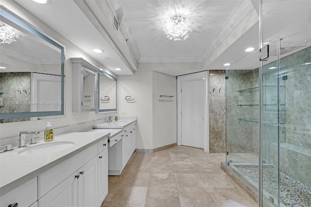 bathroom with crown molding, vanity, and walk in shower