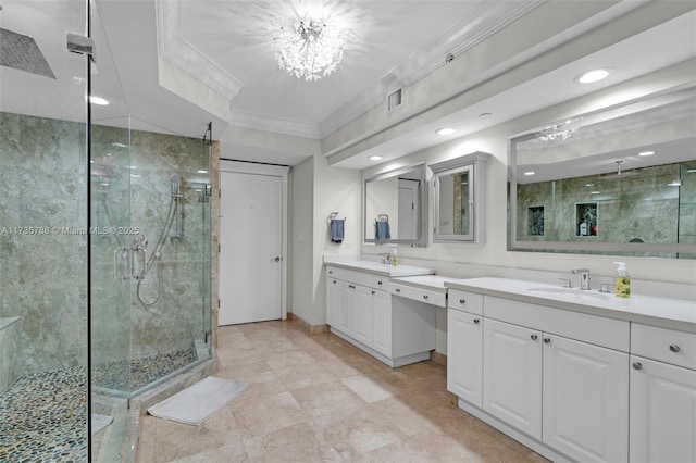 bathroom featuring a chandelier, ornamental molding, a shower with shower door, and vanity