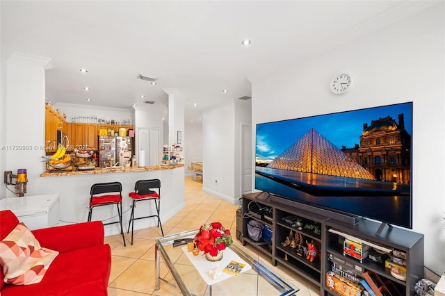 tiled living room featuring ornamental molding