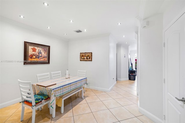 tiled dining room with crown molding