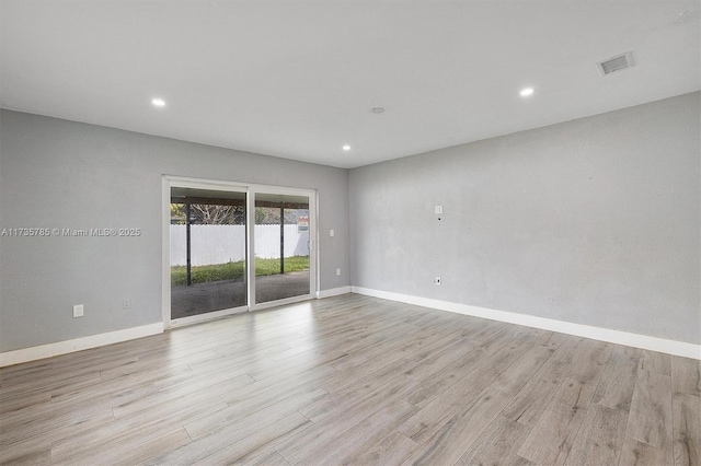 empty room with light wood-type flooring