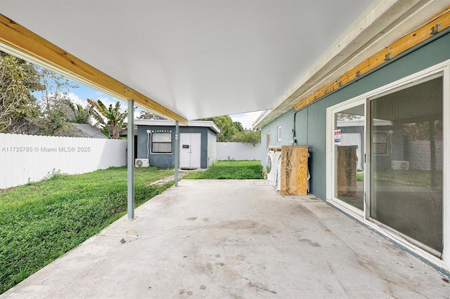 view of patio featuring an outbuilding