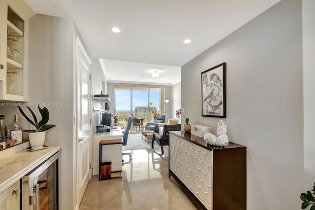 interior space featuring expansive windows and beverage cooler