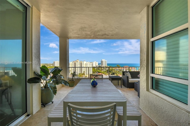 balcony featuring a water view