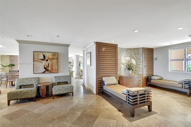 living area with ornate columns