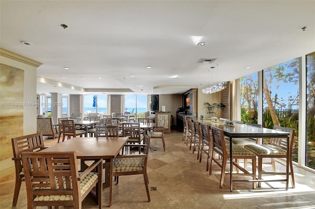 dining area featuring floor to ceiling windows