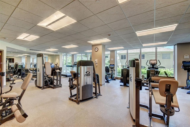 workout area with a paneled ceiling