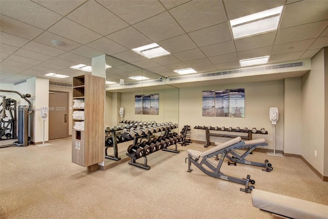 workout area with a drop ceiling