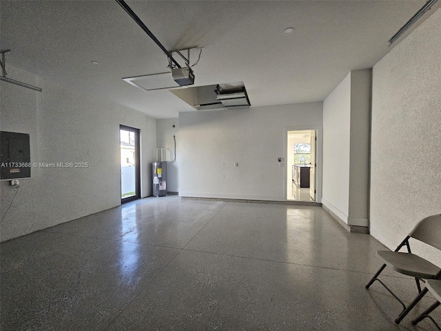 garage featuring a garage door opener, electric water heater, and electric panel